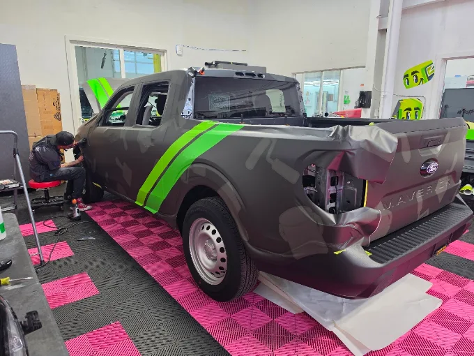 Custom camo and racing stripe wrap on Ford Maverick — Blue Rose Wraps Eugene OR